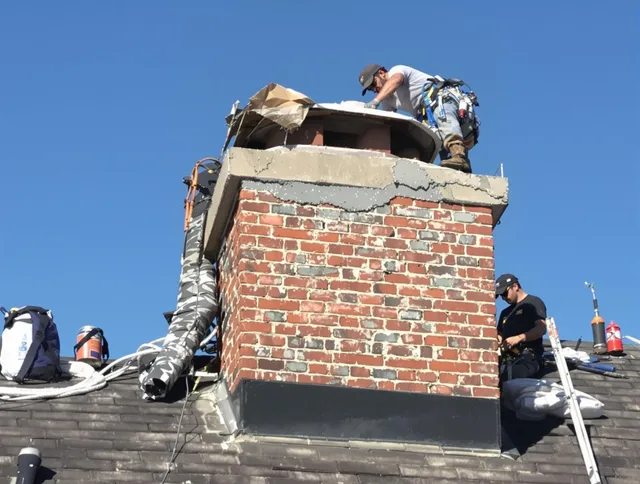 Tiverton Chimney Sweep installing a custom chimney crown in Tiverton, RI