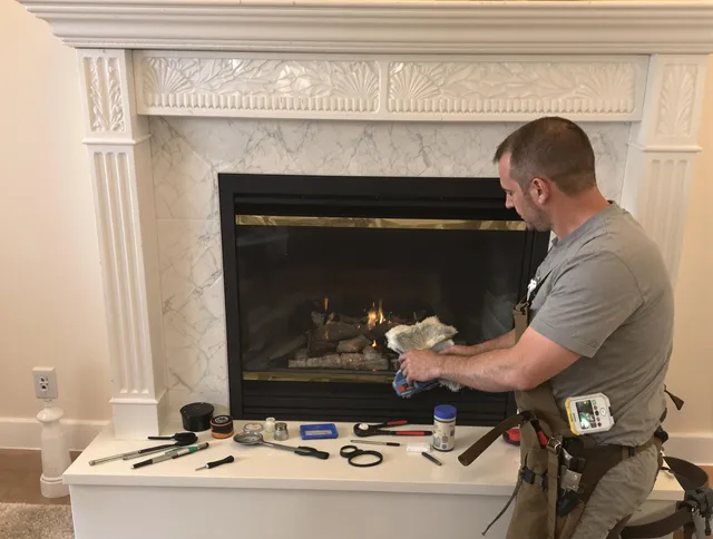 Tiverton Chimney Sweep performing fireplace maintenance in Tiverton, RI