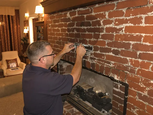 Tiverton Chimney Sweep expert fixing a fireplace in Tiverton, RI